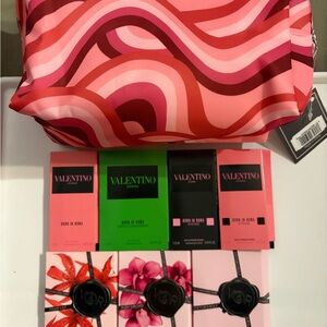 13- NWT Makeup bag and #6 perfume samples